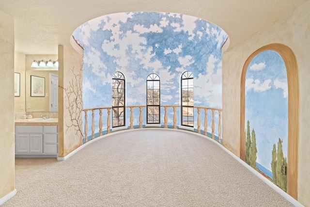 329 Park Place Dr, Georgetown, TX 78628 - hallway featuring carpet, a sink, and baseboards