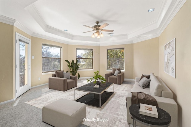 329 Park Place Dr, Georgetown, TX 78628 - living area featuring a raised ceiling, crown molding, plenty of natural light, a ceiling fan, and carpet