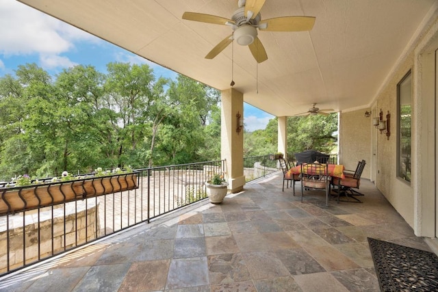 329 Park Place Dr, Georgetown, TX 78628 - view of patio featuring ceiling fan, outdoor dining space, view of scattered trees, and a balcony
