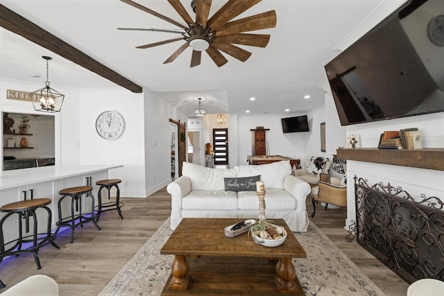 30224 Briarcrest Dr, Georgetown, TX 78628 - living area featuring baseboards, ceiling fan with notable chandelier, recessed lighting, and light wood-style flooring