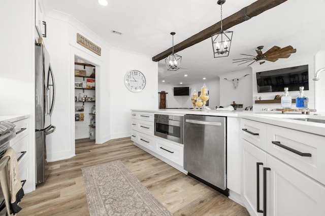 30224 Briarcrest Dr, Georgetown, TX 78628 - kitchen with appliances with stainless steel finishes, white cabinetry, and visible vents