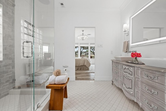 ensuite bathroom featuring a notable chandelier, vanity, ensuite bath, a shower stall, and visible vents