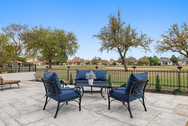 view of patio / terrace with a residential view, fence, and an outdoor hangout area