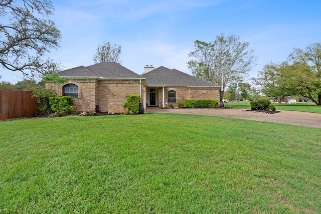 3300 Lost Oasis Holw, Austin, TX 78739 - view of front of home with brick siding, driveway, a chimney, and a shingled roof