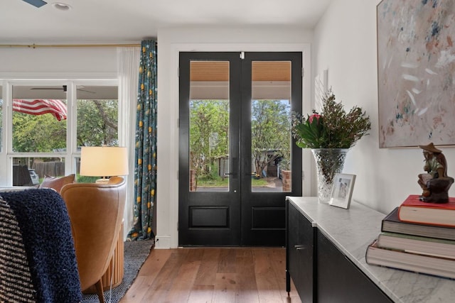 entryway with light wood-style flooring and french doors
