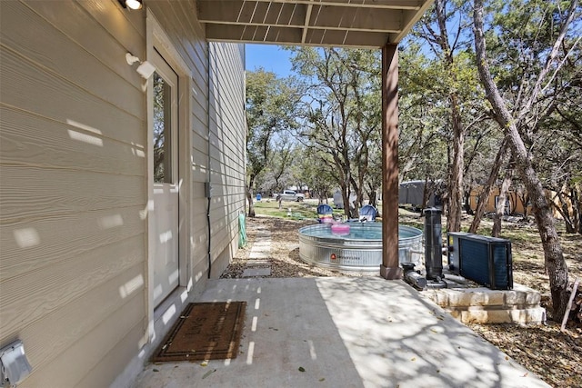 view of patio featuring a pool