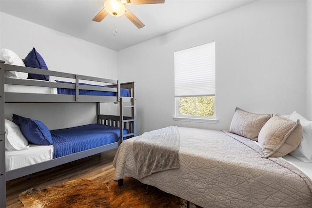 bedroom with a ceiling fan and wood finished floors
