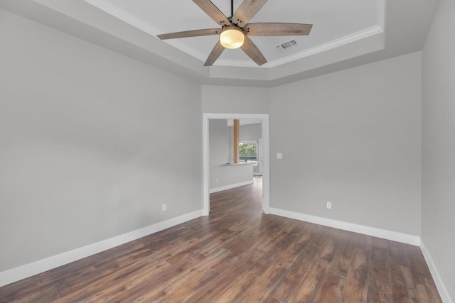 20912 High Dr, Lago Vista, TX 78645 - unfurnished room featuring a raised ceiling, ceiling fan, wood finished floors, baseboards, and ornamental molding
