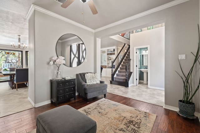 502 Explorer, Lakeway, TX 78734 - sitting room with hardwood / wood-style flooring, crown molding, a chandelier, baseboards, and stairway