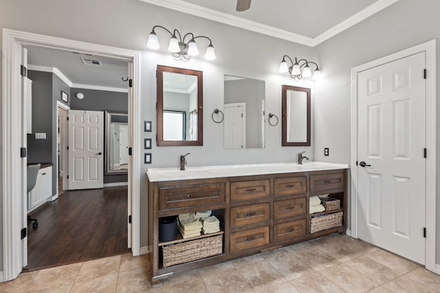502 Explorer, Lakeway, TX 78734 - bathroom with crown molding, double vanity, baseboards, and tile patterned flooring