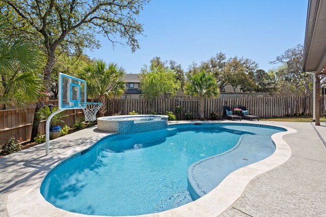 502 Explorer, Lakeway, TX 78734 - view of swimming pool featuring a fenced backyard, a pool with connected hot tub, and a patio area