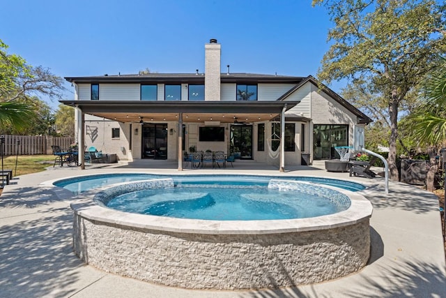 502 Explorer, Lakeway, TX 78734 - view of swimming pool featuring a ceiling fan, a patio area, and a pool with connected hot tub