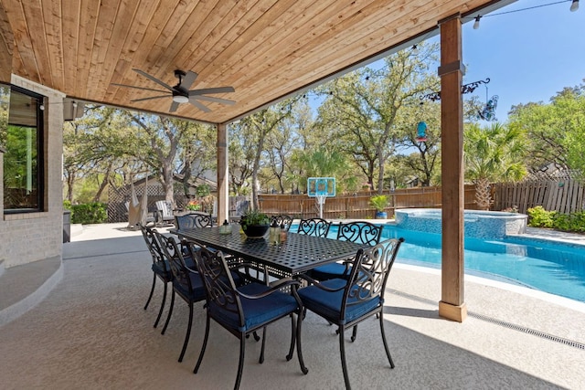 502 Explorer, Lakeway, TX 78734 - fenced backyard featuring a ceiling fan, a patio area, outdoor dining area, and a pool with connected hot tub