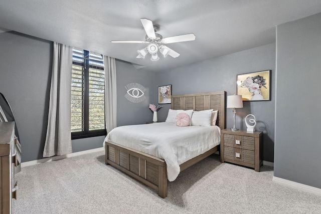 502 Explorer, Lakeway, TX 78734 - bedroom with carpet flooring, baseboards, and ceiling fan