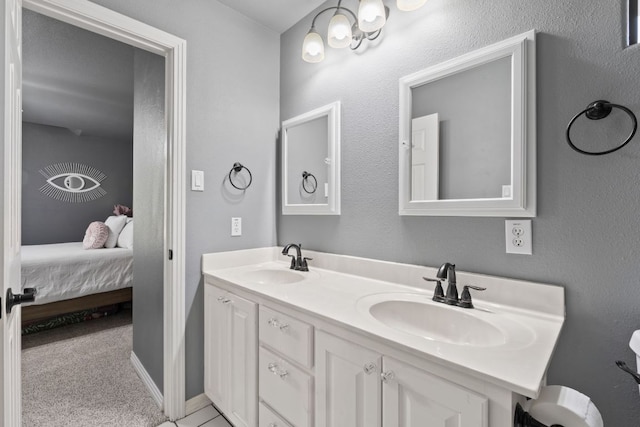 502 Explorer, Lakeway, TX 78734 - full bath with double vanity, ensuite bath, baseboards, and toilet