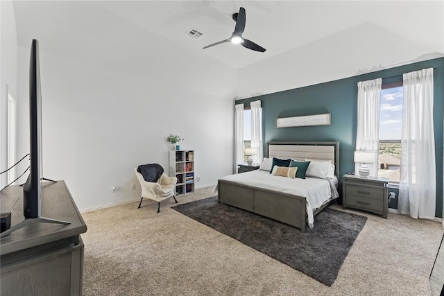 22300 Verbena Pkwy, Spicewood, TX 78669 - carpeted bedroom with multiple windows, lofted ceiling, and ceiling fan