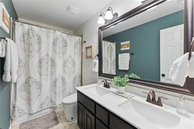 22300 Verbena Pkwy, Spicewood, TX 78669 - bathroom with tile patterned floors, double vanity, and a shower with shower curtain