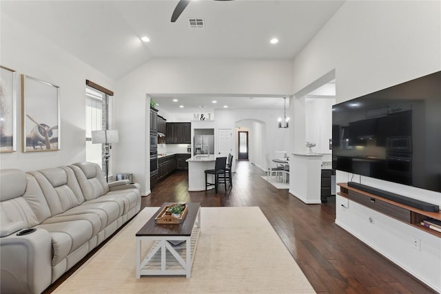 22300 Verbena Pkwy, Spicewood, TX 78669 - living area featuring a ceiling fan, arched walkways, dark wood-style floors, lofted ceiling, and recessed lighting