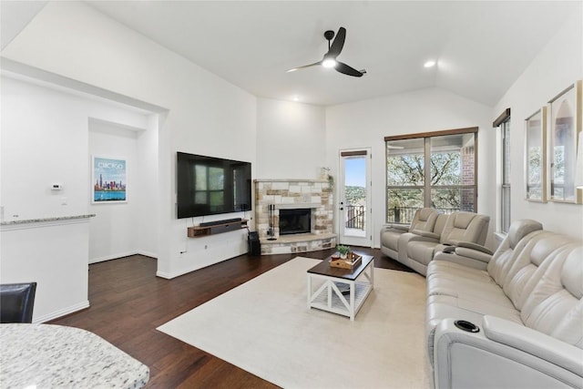 22300 Verbena Pkwy, Spicewood, TX 78669 - living area featuring a ceiling fan, lofted ceiling, a fireplace, dark wood finished floors, and recessed lighting