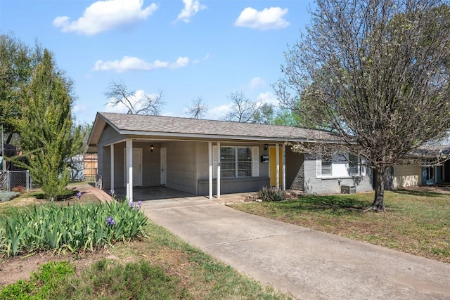 1410 Yorkshire Dr, Austin, TX 78723 - single story home featuring a carport, driveway, and a shingled roof