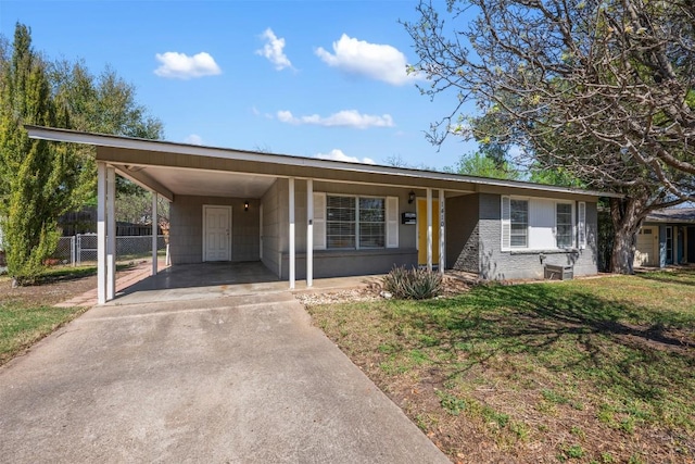 1410 Yorkshire Dr, Austin, TX 78723 - single story home with driveway, an attached carport, and brick siding