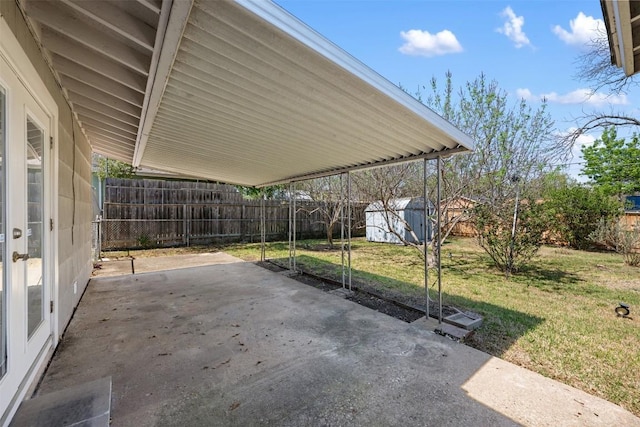 1410 Yorkshire Dr, Austin, TX 78723 - fenced backyard with a patio area, a shed, and a carport