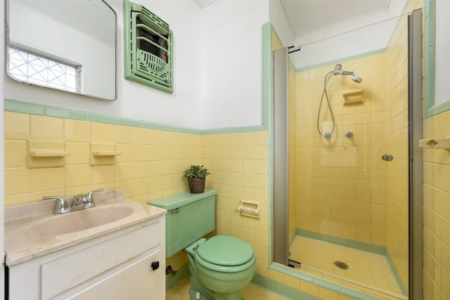 1410 Yorkshire Dr, Austin, TX 78723 - full bathroom with vanity, a shower stall, tile walls, and wainscoting