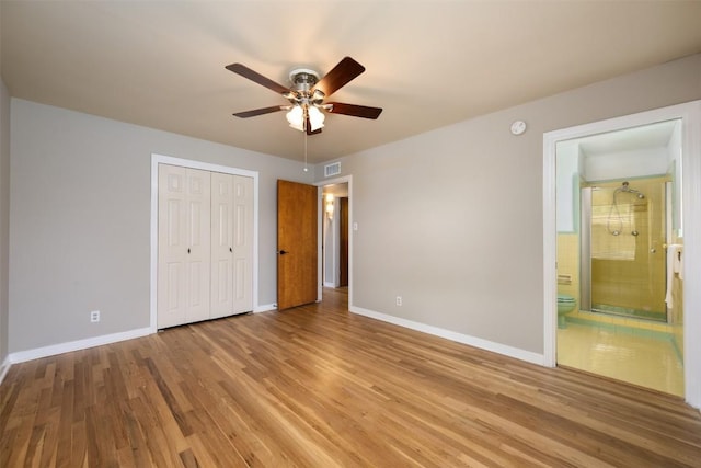 1410 Yorkshire Dr, Austin, TX 78723 - unfurnished bedroom with light wood-style flooring, a closet, ensuite bathroom, and a ceiling fan