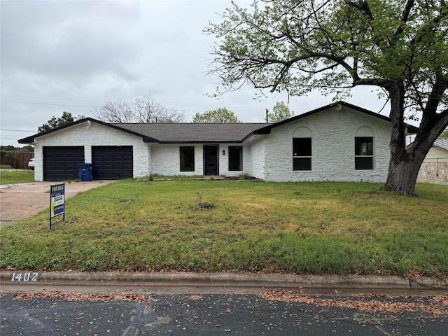 1402 Cardinal Hill Dr, Austin, TX 78758 - ranch-style house with driveway, an attached garage, and a front yard