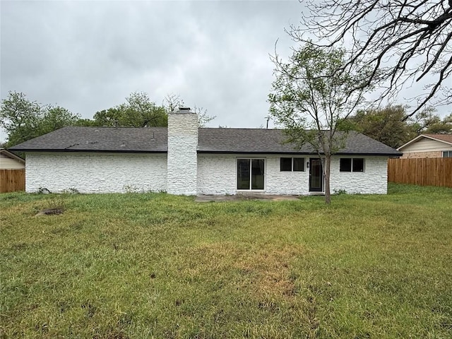 1402 Cardinal Hill Dr, Austin, TX 78758 - back of property with a chimney, stone siding, and roof with shingles