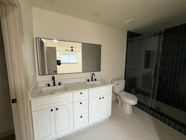 1402 Cardinal Hill Dr, Austin, TX 78758 - bathroom featuring toilet, double vanity, a stall shower, and tile patterned floors