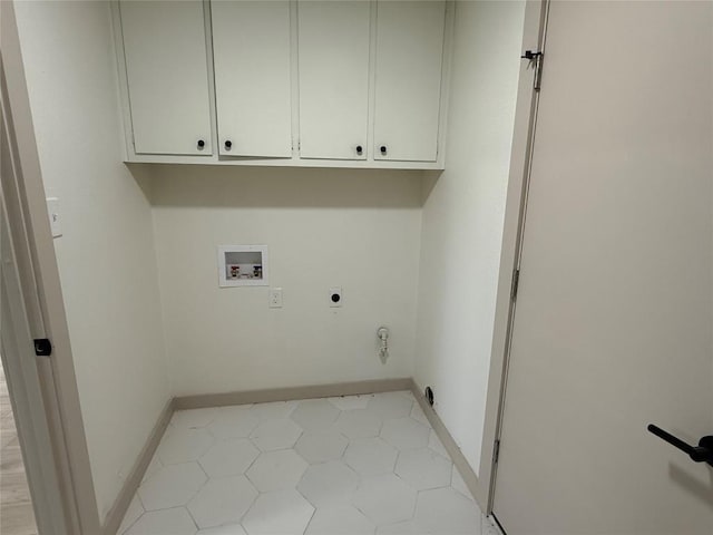 1402 Cardinal Hill Dr, Austin, TX 78758 - laundry area with electric dryer hookup, washer hookup, cabinet space, and baseboards
