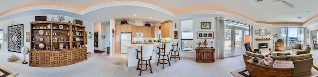 1115 W 7th St W Unit 202, Austin, TX 78703 - interior space featuring light colored carpet, a ceiling fan, decorative columns, arched walkways, and crown molding