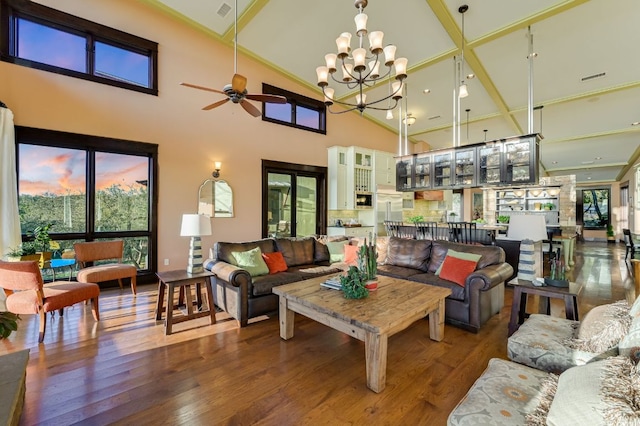 8700 Crest View Rd, Austin, TX 78737 - living room featuring high vaulted ceiling, a ceiling fan, wood finished floors, and a chandelier