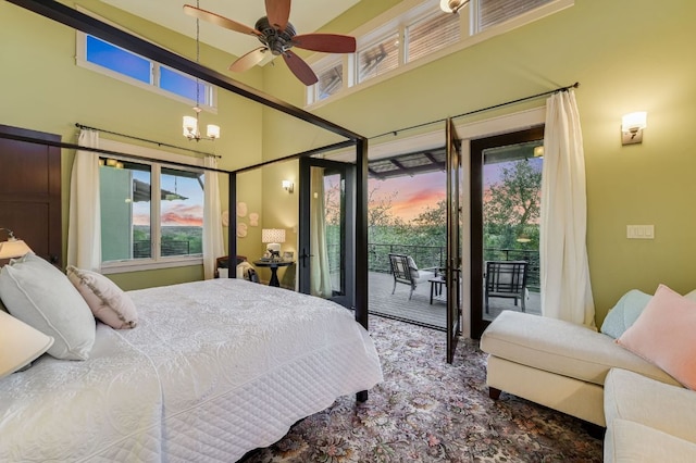 8700 Crest View Rd, Austin, TX 78737 - bedroom featuring access to outside, multiple windows, a towering ceiling, and a chandelier