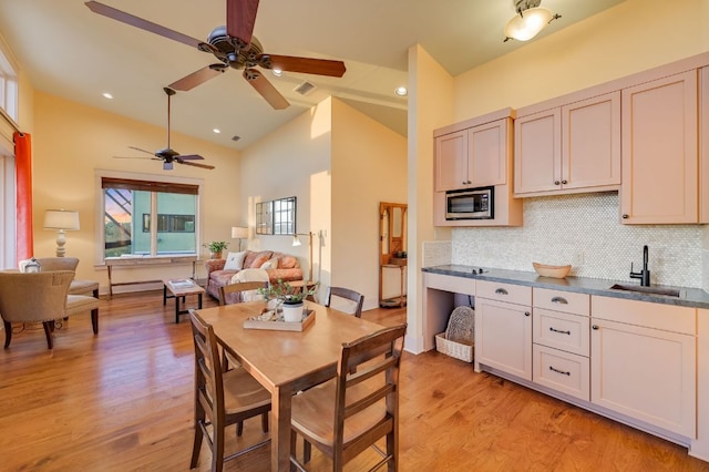 8700 Crest View Rd, Austin, TX 78737 - dining area featuring a ceiling fan, light wood-type flooring, and high vaulted ceiling