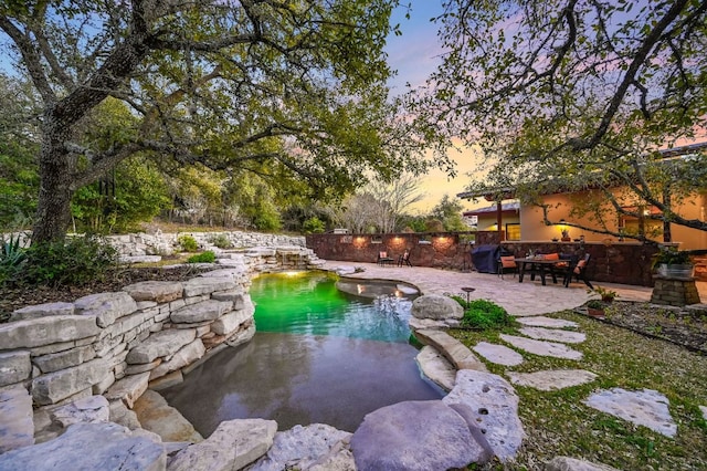 8700 Crest View Rd, Austin, TX 78737 - pool at dusk with a patio