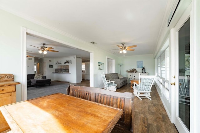 658 Golden Beach Dr, Buchanan Dam, TX 78609 - dining area with dark wood-style floors, visible vents, crown molding, and ceiling fan