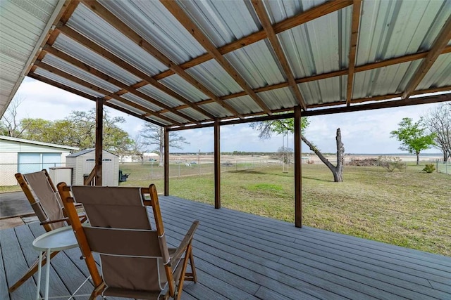 658 Golden Beach Dr, Buchanan Dam, TX 78609 - wooden deck with an outbuilding, a storage unit, and a yard