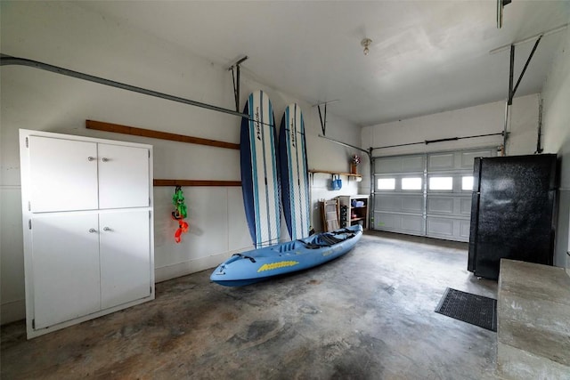 658 Golden Beach Dr, Buchanan Dam, TX 78609 - garage with freestanding refrigerator