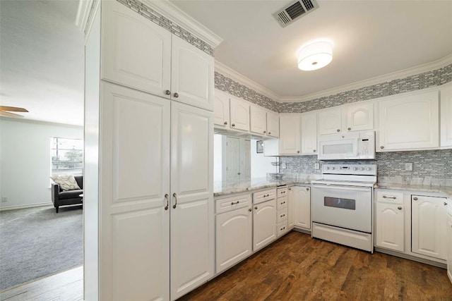 658 Golden Beach Dr, Buchanan Dam, TX 78609 - kitchen featuring decorative backsplash, visible vents, dark wood-style floors, and white appliances