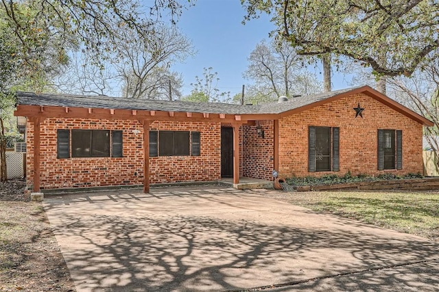 3108 Matador Dr, Austin, TX 78741 - view of front of property with brick siding and roof with shingles