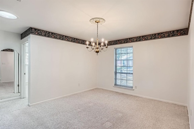 3108 Matador Dr, Austin, TX 78741 - empty room with carpet flooring, baseboards, and a chandelier