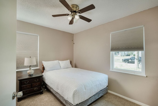 818 Kimbro St, Taylor, TX 76574 - carpeted bedroom with ceiling fan and baseboards