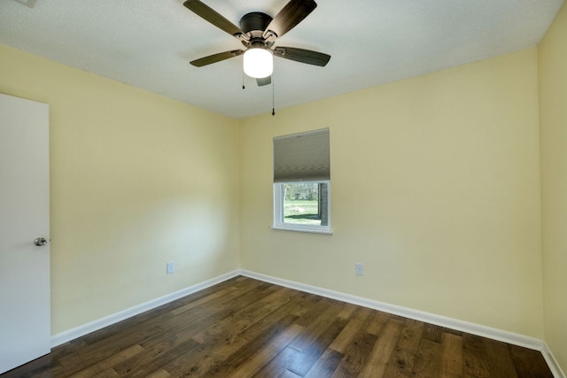 818 Kimbro St, Taylor, TX 76574 - spare room with baseboards, dark wood-type flooring, and a ceiling fan