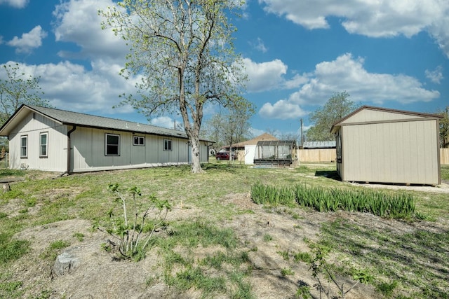818 Kimbro St, Taylor, TX 76574 - view of yard featuring a shed