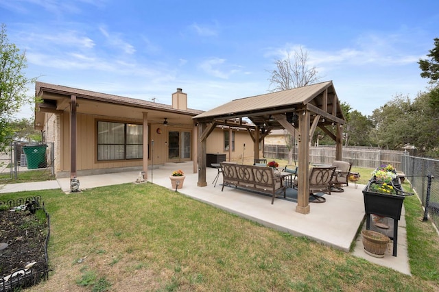 20807 Boggy Ford Rd, Lago Vista, TX 78645 - rear view of house featuring a fenced backyard, a chimney, ceiling fan, and a patio