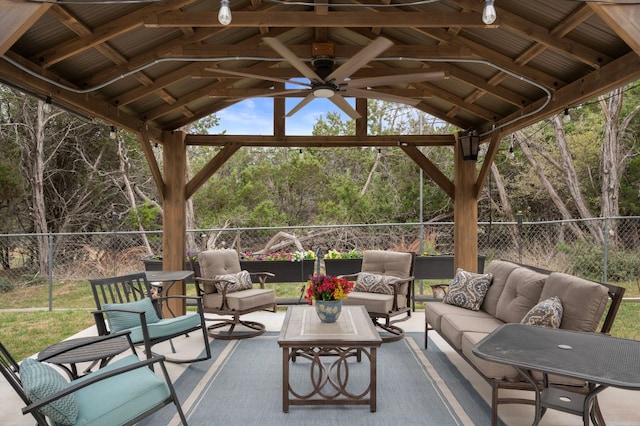 20807 Boggy Ford Rd, Lago Vista, TX 78645 - fenced backyard with outdoor lounge area, a gazebo, ceiling fan, and a patio area