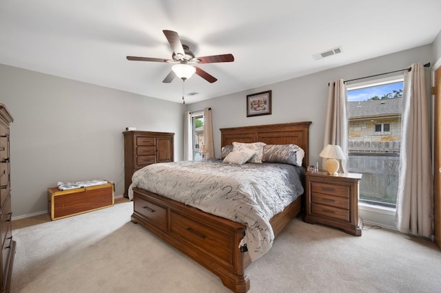 20807 Boggy Ford Rd, Lago Vista, TX 78645 - bedroom featuring light colored carpet and ceiling fan