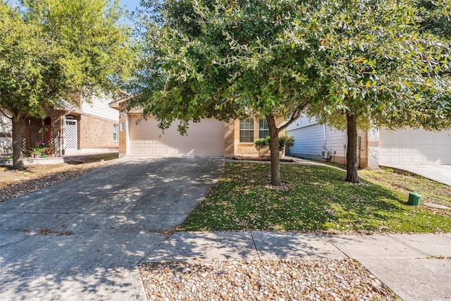 132 Grazing Horse Ln, Manchaca, TX 78652 - obstructed view of property with concrete driveway and a garage